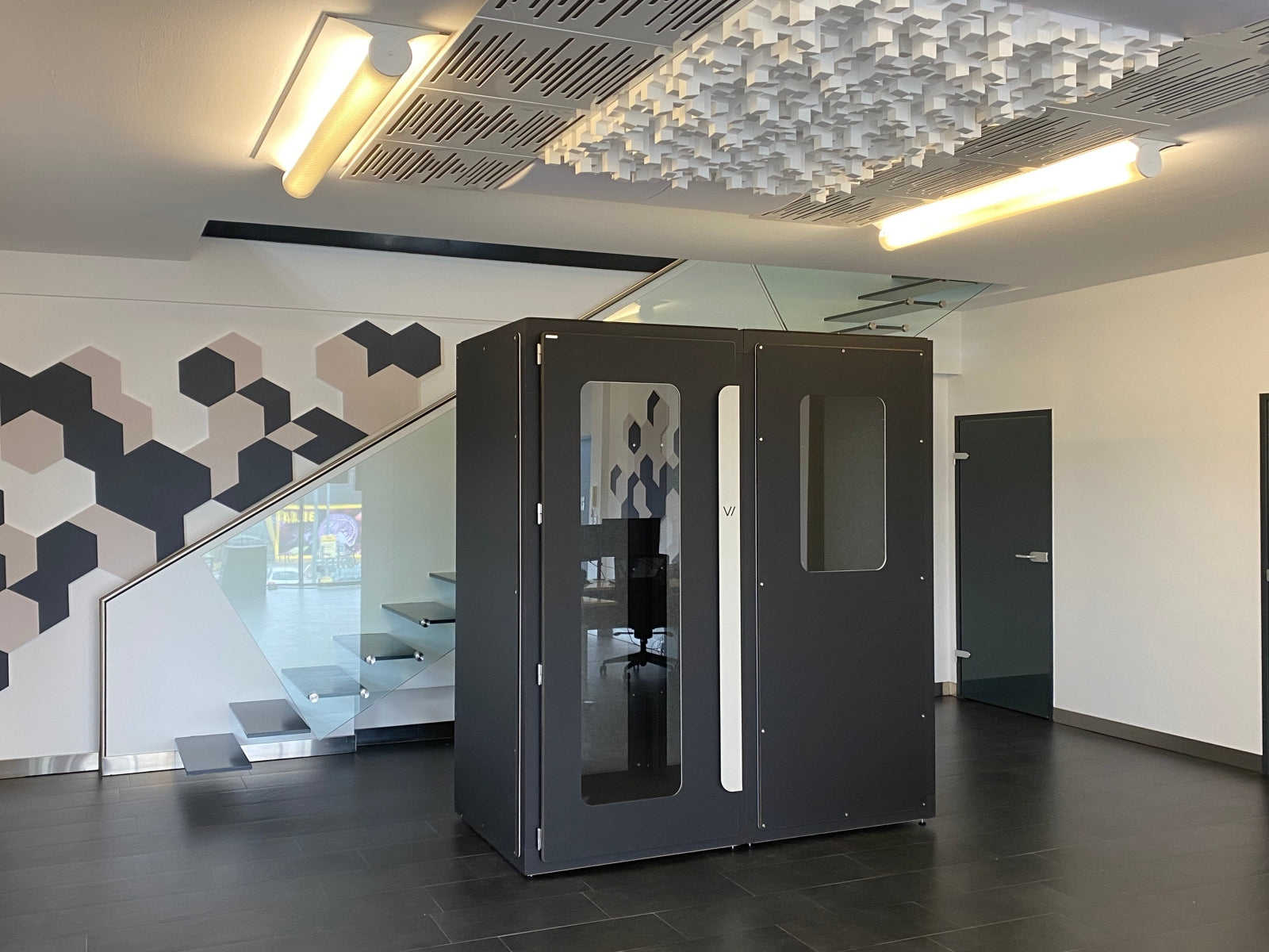 VicBooth Ultra 1x2 soundproof booth in Black Matte installed in an office for recording